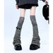 Socks cover a leather buckle + gray over the knee